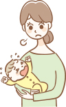 泣いている赤ちゃんを抱っこするお母さん